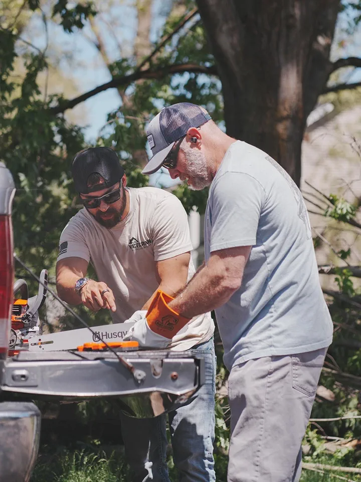 Veteran Roofing workers helping during storm recovery.